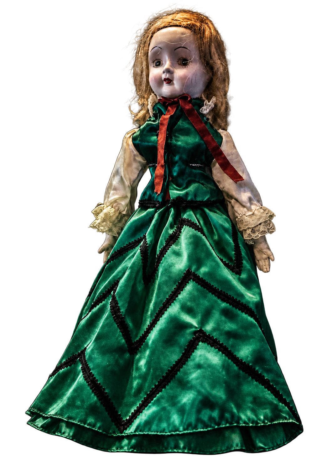 Liza, an antique porcelain doll in a green dress